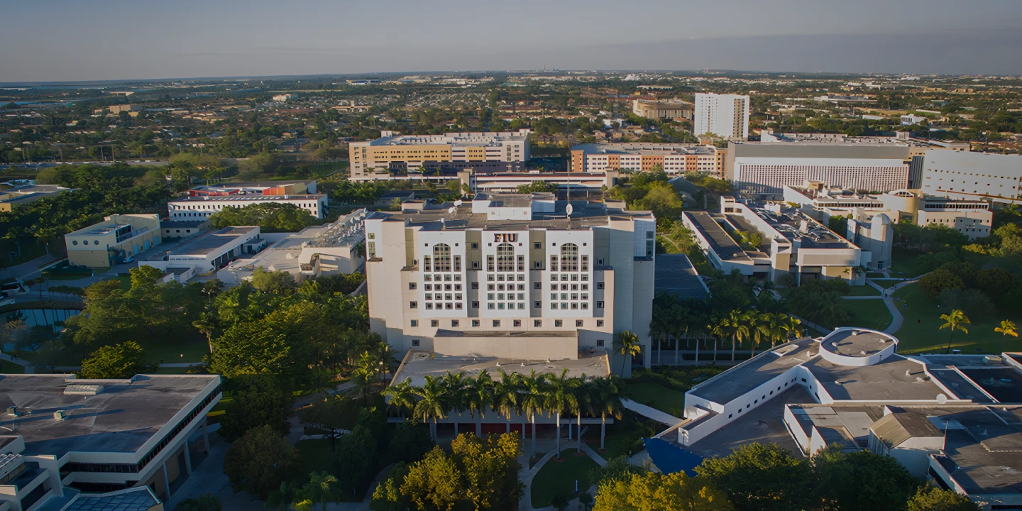 FIU campus with lake and palm trees